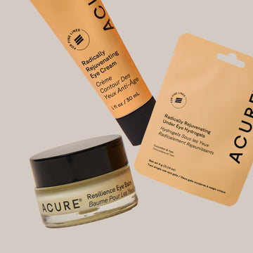 Acure eye cream, under eye hydrogels and  and eye balm on a neutral background